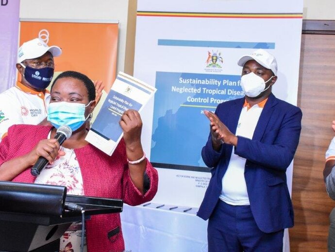 Participants applaud as Hon. Minister of State for Health, Hon. Rhobinah Nabbanja announces the official launch of Uganda’s Sustainability Plan for Neglected Tropical Diseases. 