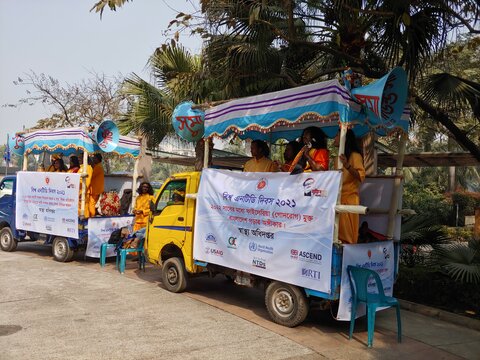 Bangladesh: A folk band rides on the back of a truck playing music as part of World NTD Day celebrations 