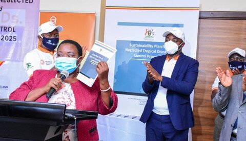 Participants applaud as Hon. Minister of State for Health, Hon. Rhobinah Nabbanja announces the official launch of Uganda’s Sustainability Plan for Neglected Tropical Diseases. 