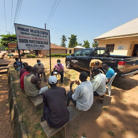 Community members gather for a listening session in Cross River State Nigeria. 