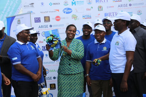 Dr. Godwin Mollel, Deputy Minister of Health, Hon. Neema Lugangira, Member of Parliament, Dr. George Kabona, Program Manager for NTD Control Program, and others unveil the new Master plan and Sustainability Plan for NTDs in Tanzania