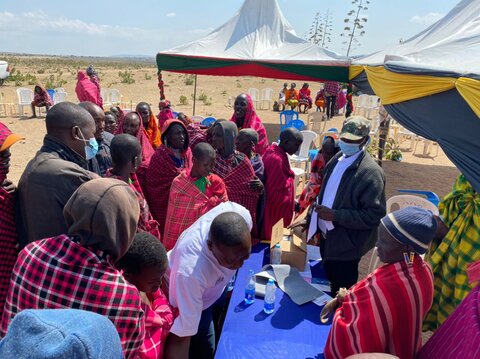 Attendees at the launch of the cross-border treatment campaign receive medicines for trachoma, a neglected tropical disease.  