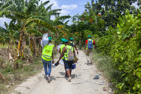 Volunteers travel to farmers’ fields to administer medicine for lymphatic filariasis during Haiti’s annual LF campaign. Photo credit: RTI International/ Emmanuel Riscka Chery
