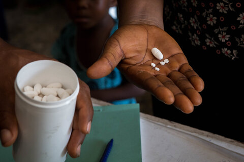 An individual receives medicines during a mass treatment campaign for NTDs in Nigeria. 