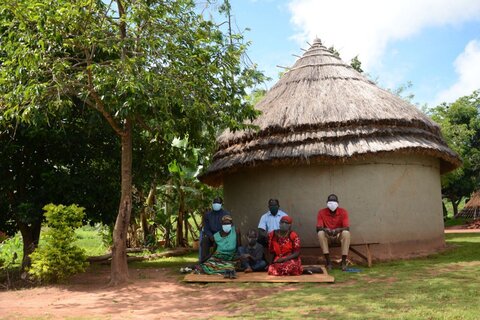 Fred Matalocu with his family. Photo credit: Aggrey Mugisha, The Carter Center