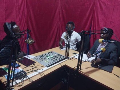Representatives discuss NTDs in Tanzania during a radio interview in Arusha