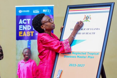 The Minister of Health, Dr. Jane Ruth Aceng Ocero, signing and launching the NTD Master Plan (2023-2027) for Uganda 