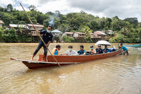 A team from the Indonesian Ministry of Health travels by boat to reach some of the most remote villages in Indonesia to take blood samples after nightfall. Photo Credit: RTI International/Oscar Siagian