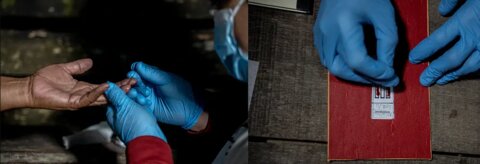 Health workers collect blood samples from people in remote villages in Indonesia at night. With the help of trained lab technicians like Arief, they smear the blood sample in three lines on a microscope slide. A paper stencil is placed under the slide to ensure correct positioning and quantity. Photo Credit: RTI International/Oscar Siagian