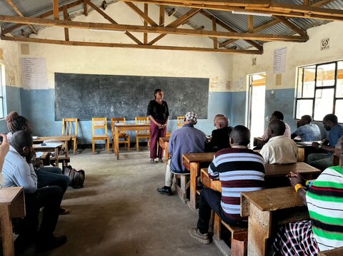 An NTDCP staff member addresses community members during site visit to Monduli District, Tanzania. Photo credit: RTI International
