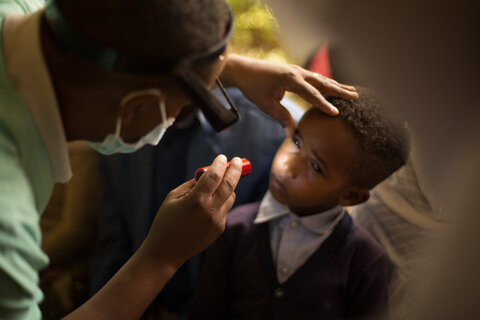 A boy is screened for trachoma in Ethiopia. People are checked for trachoma in a clinic in Ethiopia.   Photo Credit: RTI International/ Timothy La Rose 