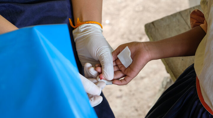 A child has their blood drawn during a survey for lymphatic filariasis in Lao PDR. Photo credit: Kim Won, CDC